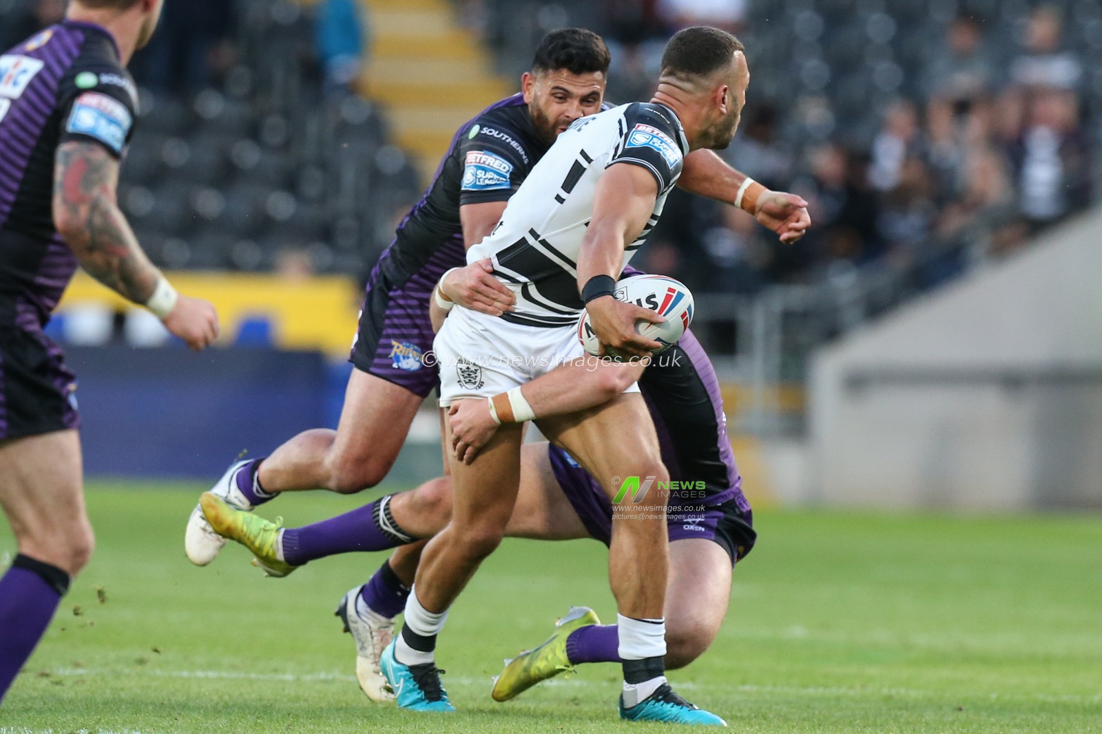 Carlos Tuimavave (3) of Hull FC looks to pass the ball