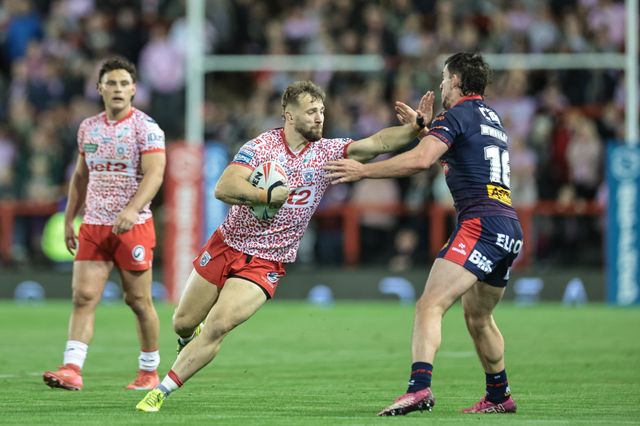 Matty Davis of Leigh Leopards hands off Matt Whitley of St Helens during the Betfred Super League Round 26 match Leigh Leopards vs St Helens at Leigh Sports Village, Leigh, United Kingdom, 12th September 2025

(Photo by Mark Cosgrove/News Images)