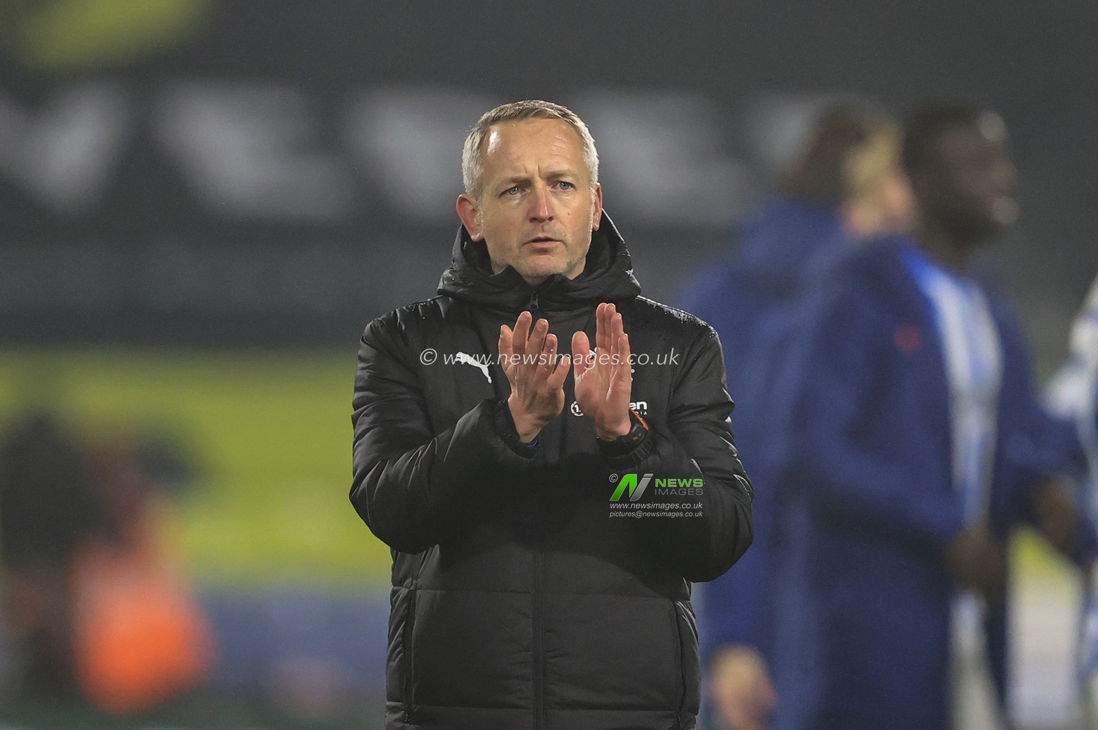 Neil Critchley head Coach of Blackpool applauds the traveling fans