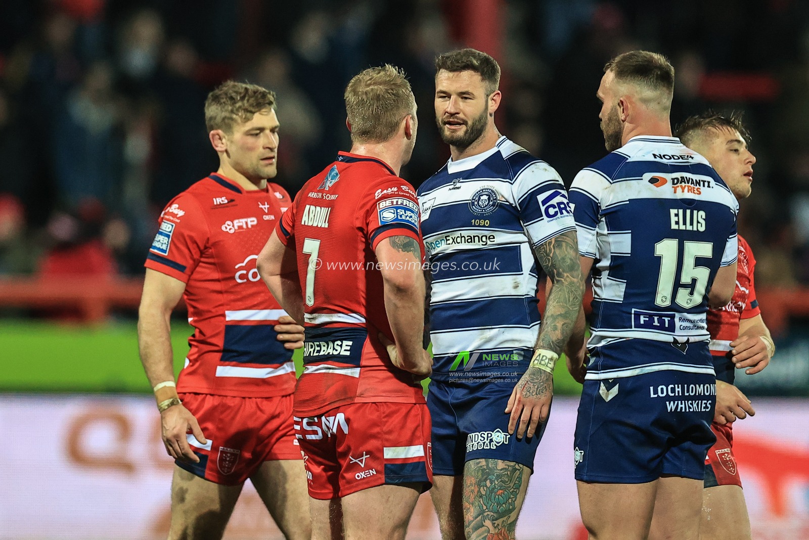 Jordan Abdull #7 of Hull KR and Zak Hardaker #3 of Wigan Warriors shake hands