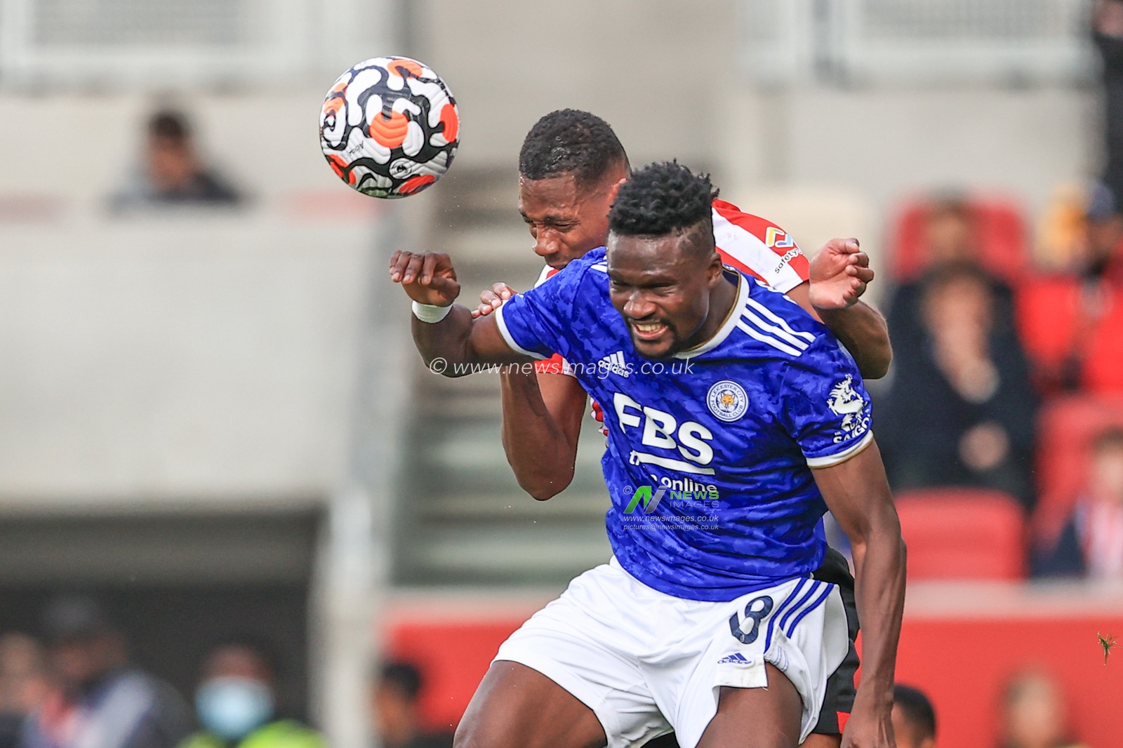 Daniel Amartey #18 of Leicester City and Ethan Pinnock #5 of Brentford battle for the high ball