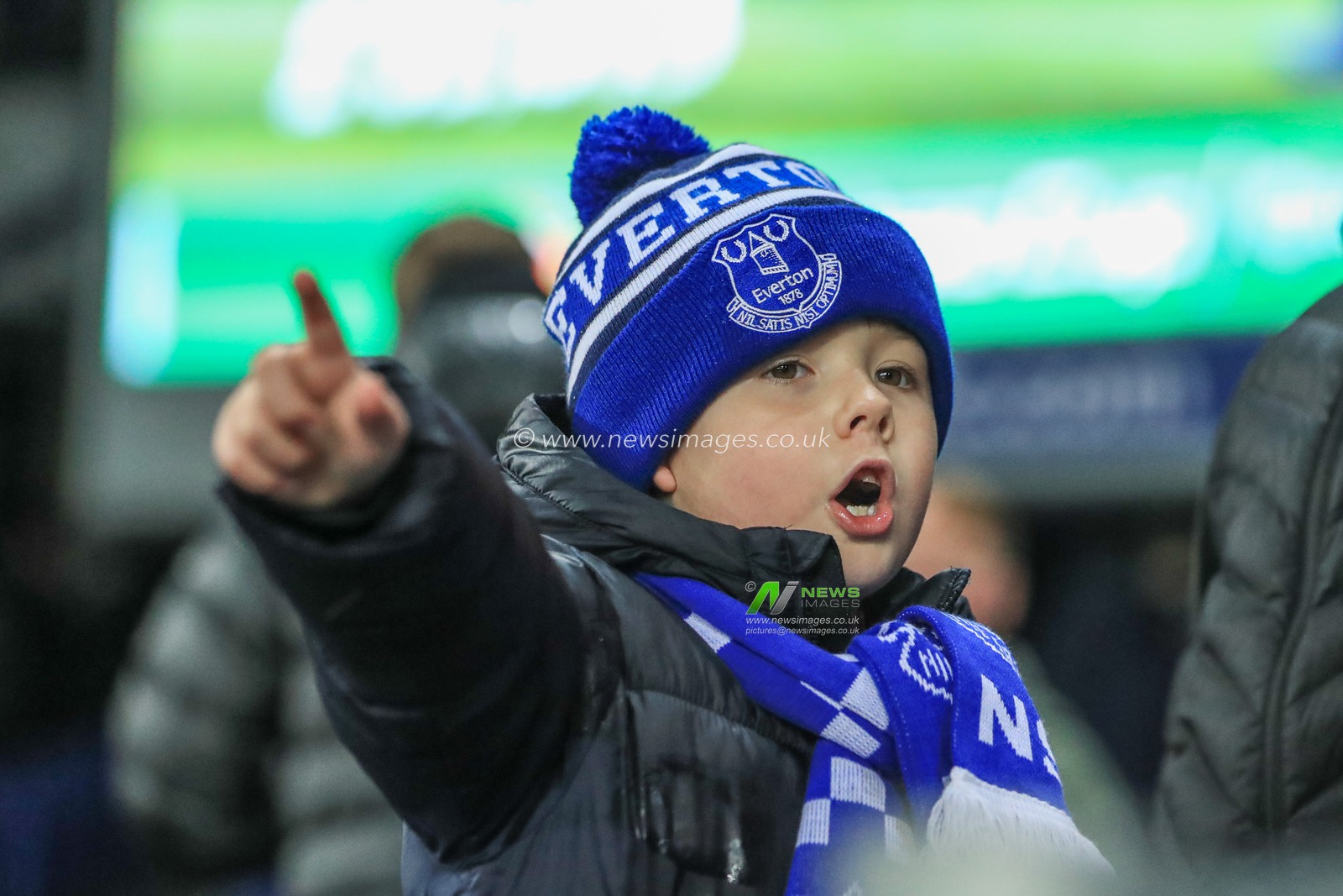 18th December 2019, Goodison Park, Liverpool, England; Carabao Cup, Everton v Leicester City : A young Everton fan watches his team warm up 

Credit: Mark Cosgrove/News Images