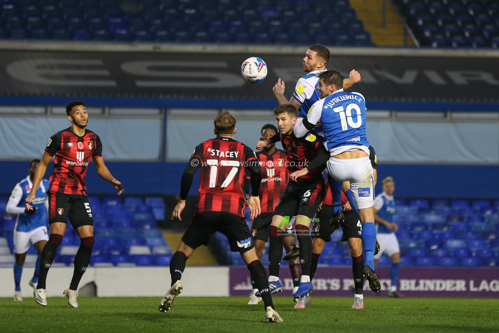 Harlee Dean #12 of Birmingham City and Lukas Jutkiewicz #10 of Birmingham City jump for a header following a free kick