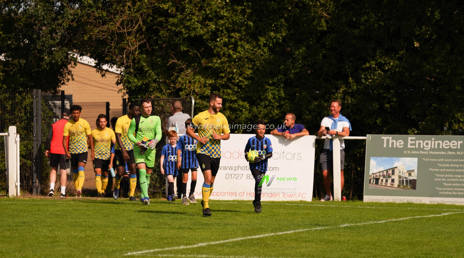 Ryan Plowright Captain Harpenden Town FC leads his team out. Aveley beat Harpenden Town FC 3:0