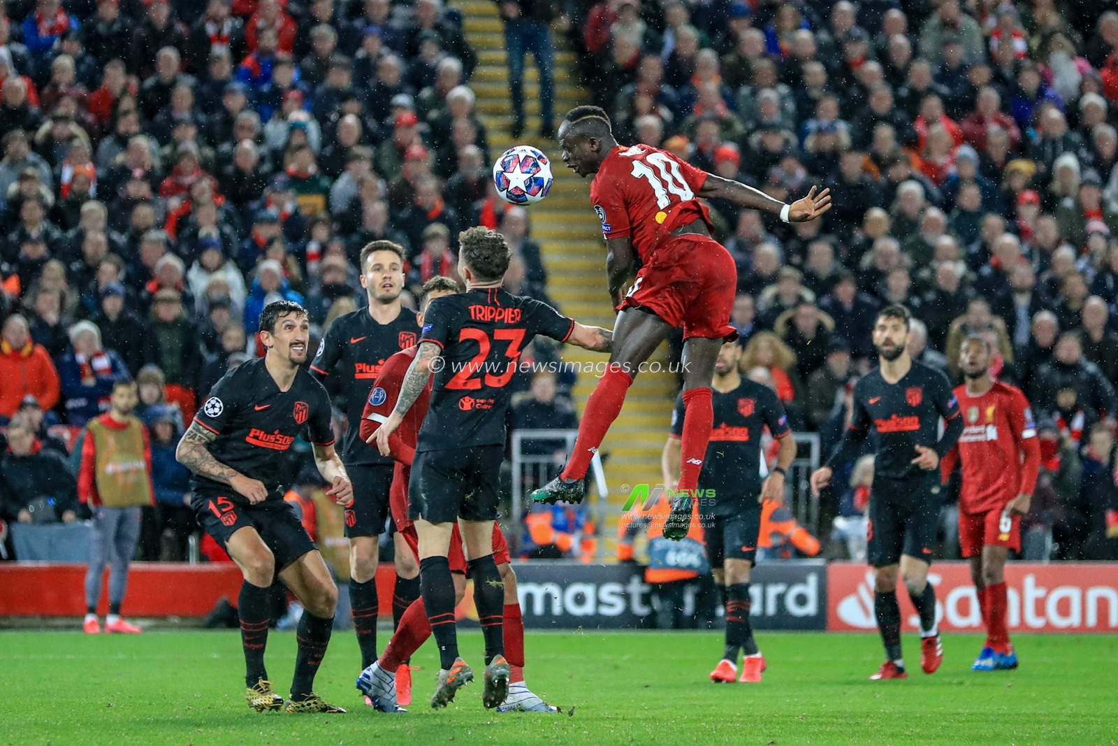 11th March 2020, Anfield, Liverpool, England; UEFA Champions League, Round of 16 Leg 2 of 2, Liverpool v Atletico Madrid : Sadio Mane (10) of Liverpool  towers over Kieran Trippier (23) of Atletico Madrid  to head on goal