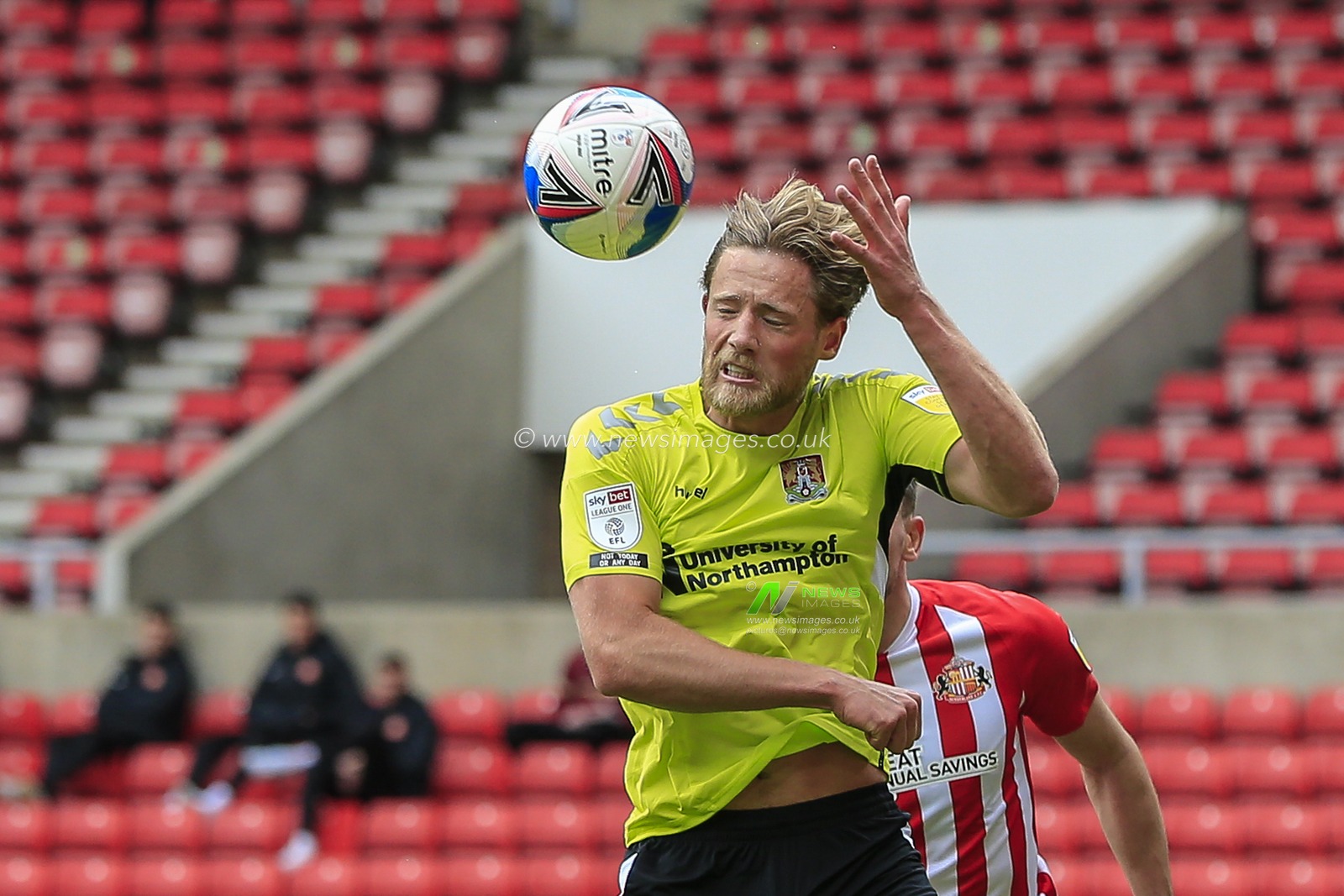 Fraser Horsfall #6 of Northampton Town heads the ball