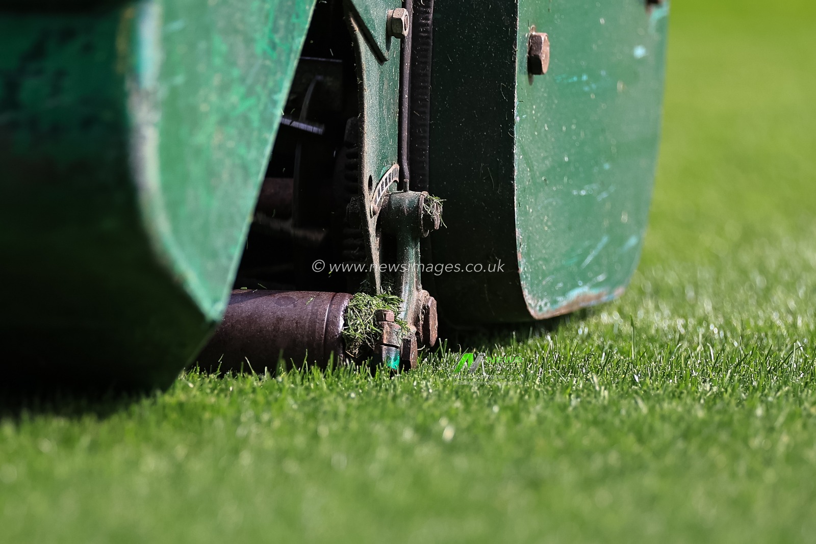Huddersfield Town ground staff making a final cut to the turf