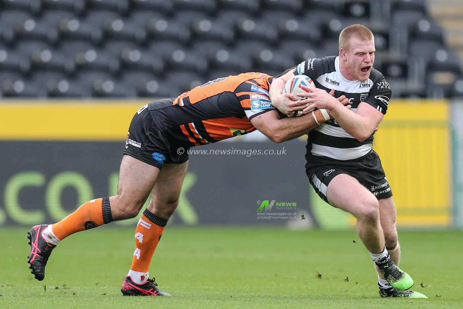 Brad Fash (20) of Hull FC runs with the ball