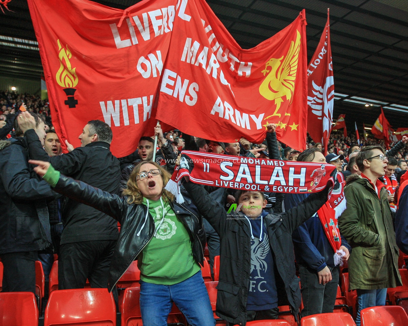 24th April 2018 , Anfield, Liverpool, England; UAFA Champions League Semi Final, first leg, Liverpool v Roma ; A young Liverpool lad is singing with his Mum
