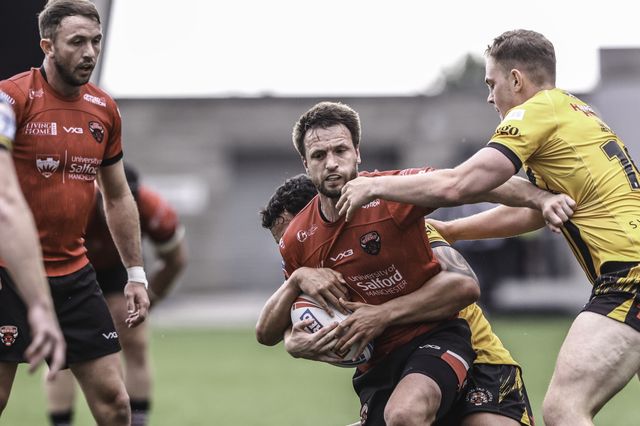 Joe Mellor of Salford Red Devils is tackled during the Betfred Super League Round 18 match Salford Red Devils vs Castleford Tigers at Salford Community Stadium, Eccles, United Kingdom, 13th July 2025

(Photo by Alfie Cosgrove/News Images)