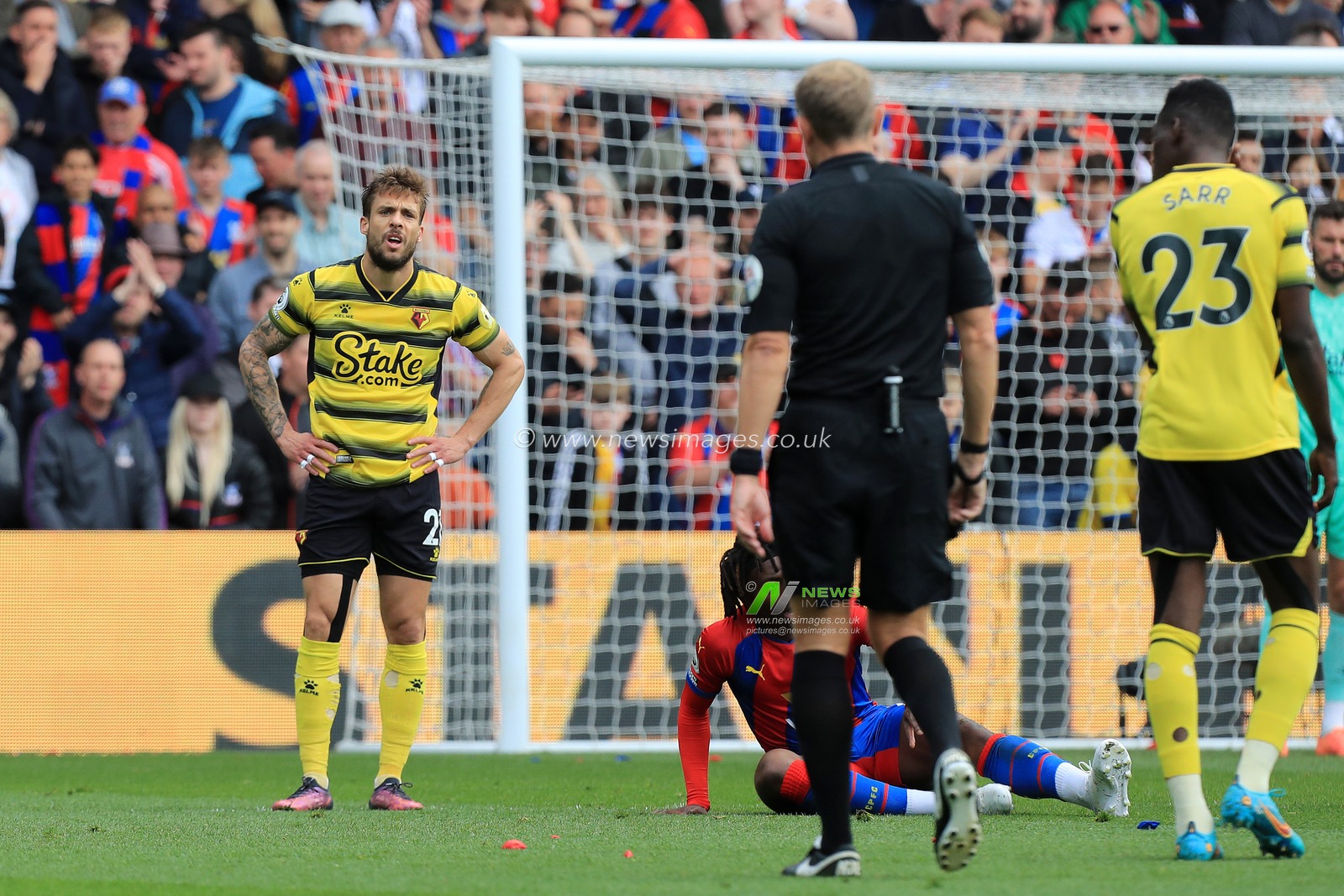 Kiko Femenia #21 of Watford remonstrates with referee, Graham Scott