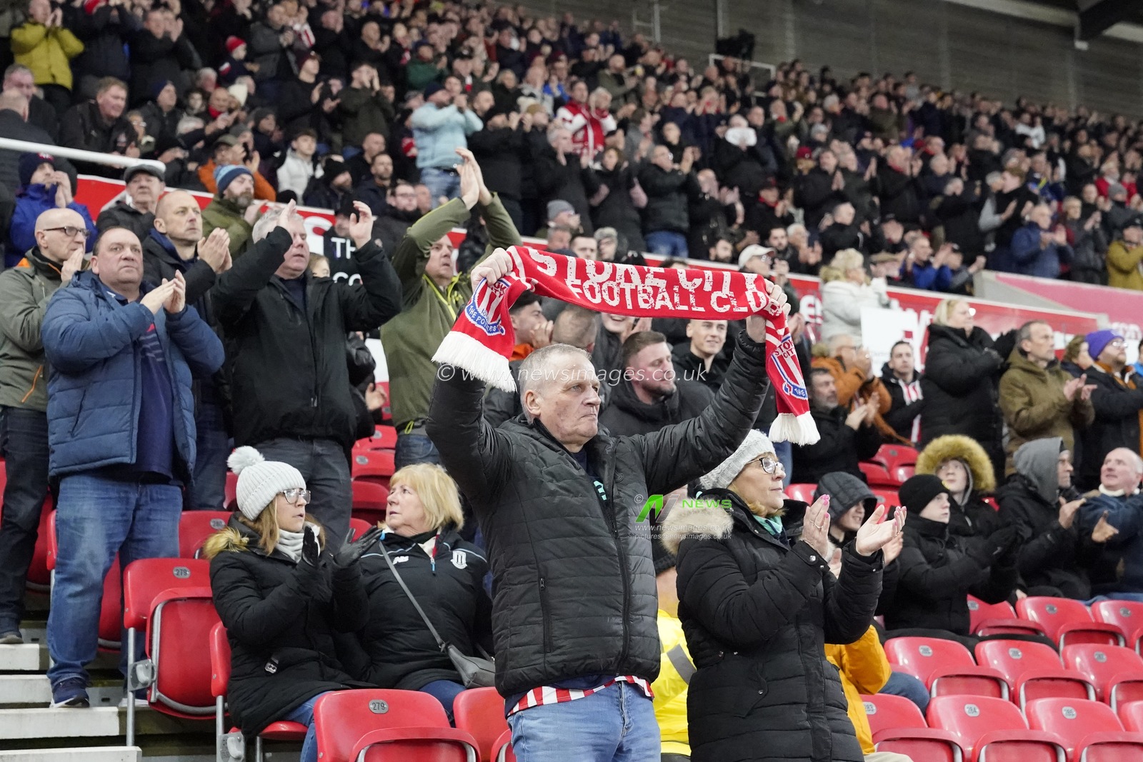 Stoke City fans hold a minutes applause on the 4th minute for Paul Handysides who died recently during the Sky Bet Championship match Stoke City vs Queens Park Rangers at Bet365 Stadium, Stoke-on-Trent, United Kingdom, 14th February 2024

(Photo by Steve Flynn/News Images)