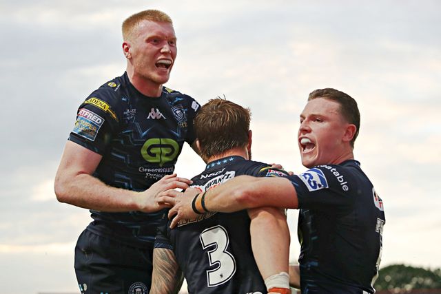 Adam Keighran of Wigan Warriors celebrates his try with Zach Eckersley of Wigan Warriors and Jai Field of Wigan Warriors during the Betfred Super League round 15 match Wakefield Trinity vs Wigan Warriors at DIY Kitchens Stadium, Wakefield, United Kingdom, 20th June 2025(Photo by Sam Eaden/News Images)