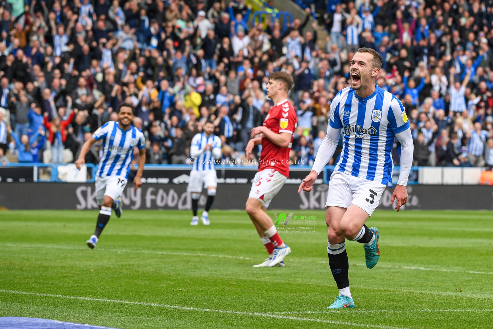 Harry Toffolo #3 of Huddersfield Town celebrates scoring a goal to make it 1-0