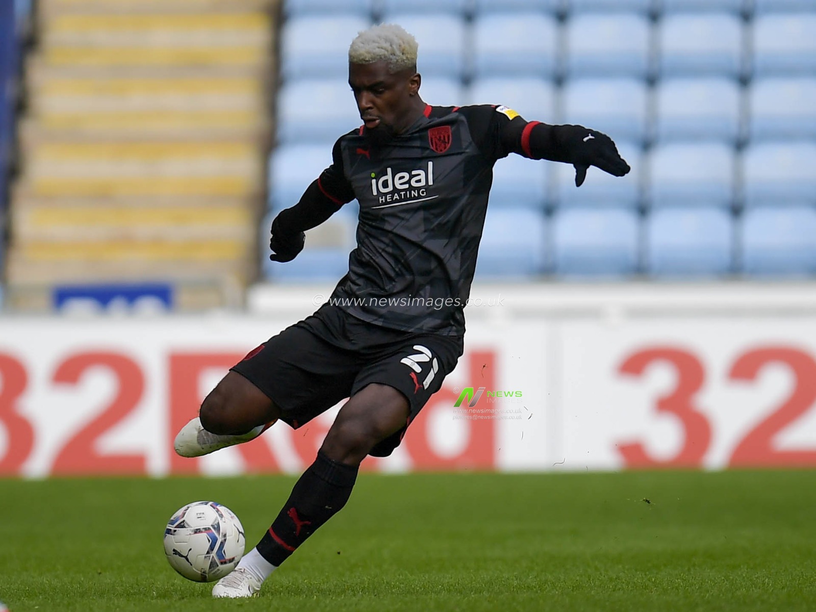 Cedric Kipre #21 of West Bromwich Albion with the ball