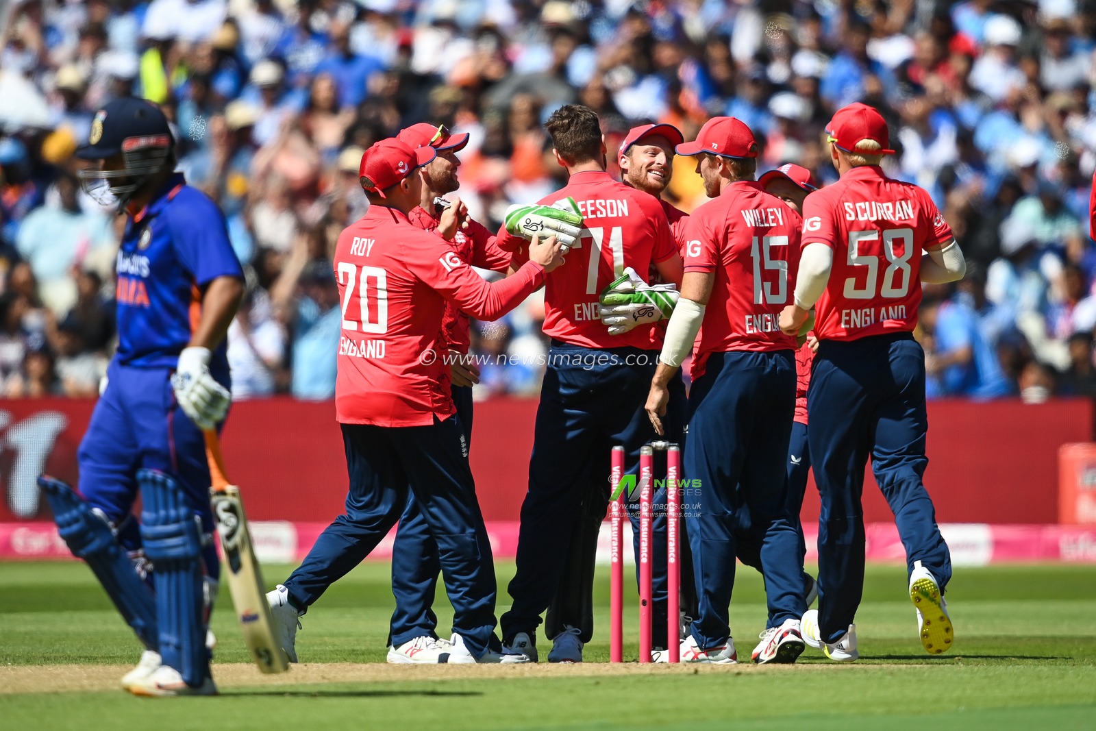 Richard Gleeson of England celebrates taking the wicket the Rohit Sharma of India caught by Jos Buttler of England
