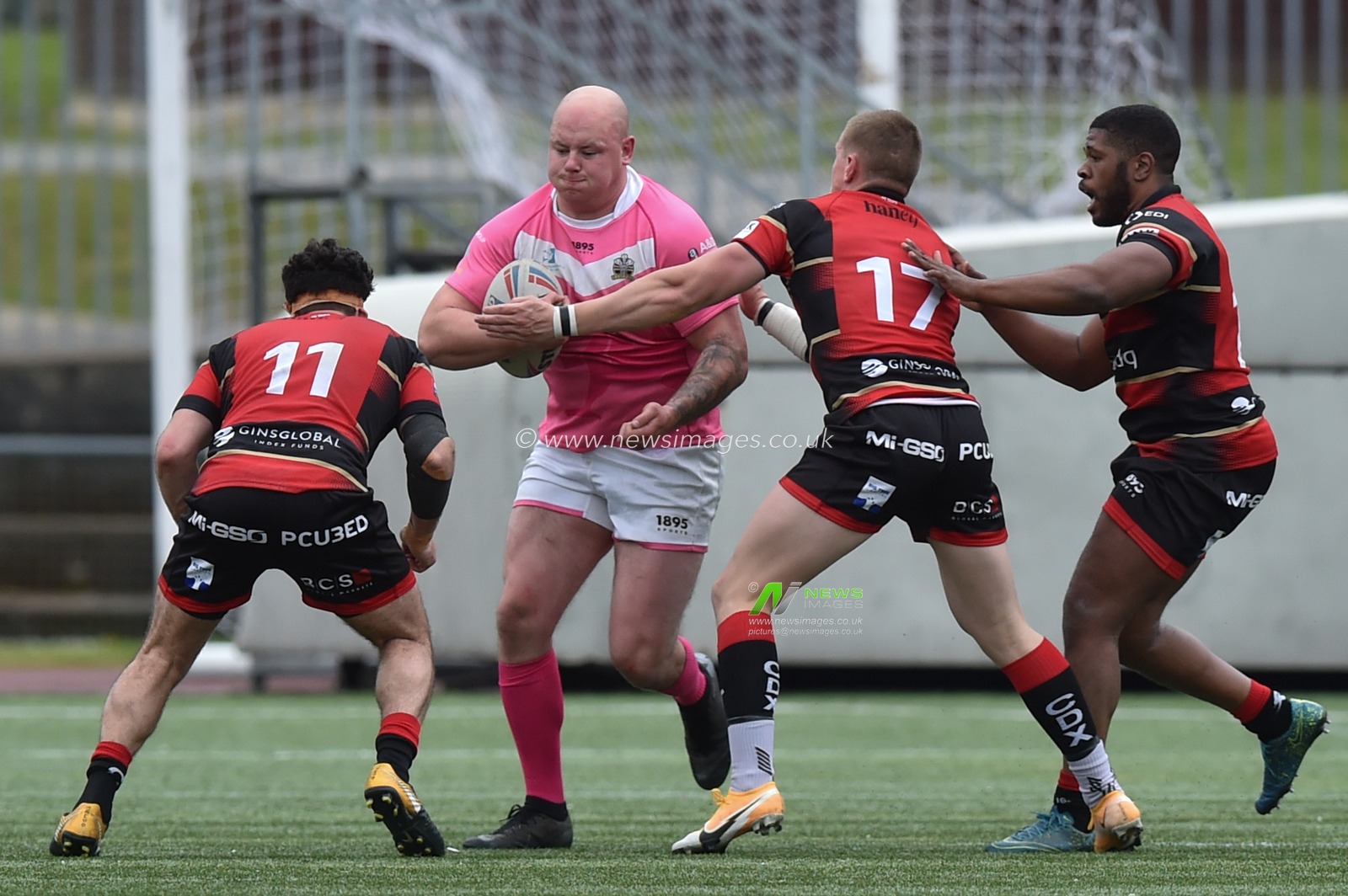 Brad Brennan of North Wales Crusaders  busts the tackle from Lamont Bryan of London Skolars