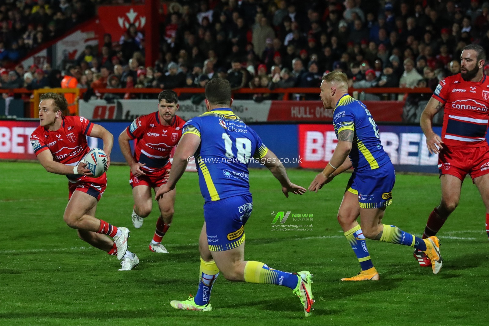 Jez Litten #14 of Hull KR runs across the Warrington line