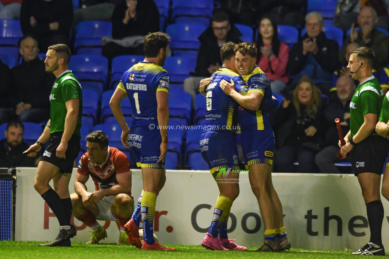 Matty Ashton #5 of Warrington Wolves celebrates scoring a try to make it 26-12