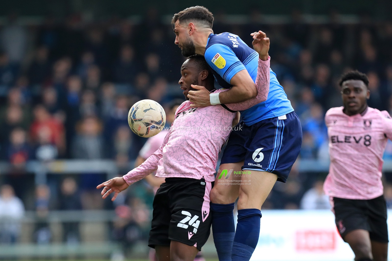 Ryan Tafazolli #6 of Wycombe Wanderers climbs over Saido Berahino #24 of Sheffield Wednesday