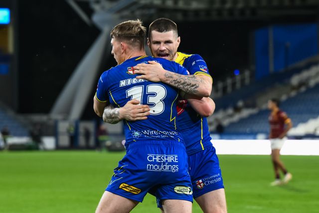 John Bateman of Warrington Wolves and Matty Nicholson of Warrington Wolves celebrate at the end of the Betfred Super League Round 26 match Huddersfield Giants vs Warrington Wolves at John Smith's Stadium, Huddersfield, United Kingdom, 14th September 2024

(Photo by Craig Thomas/News Images)