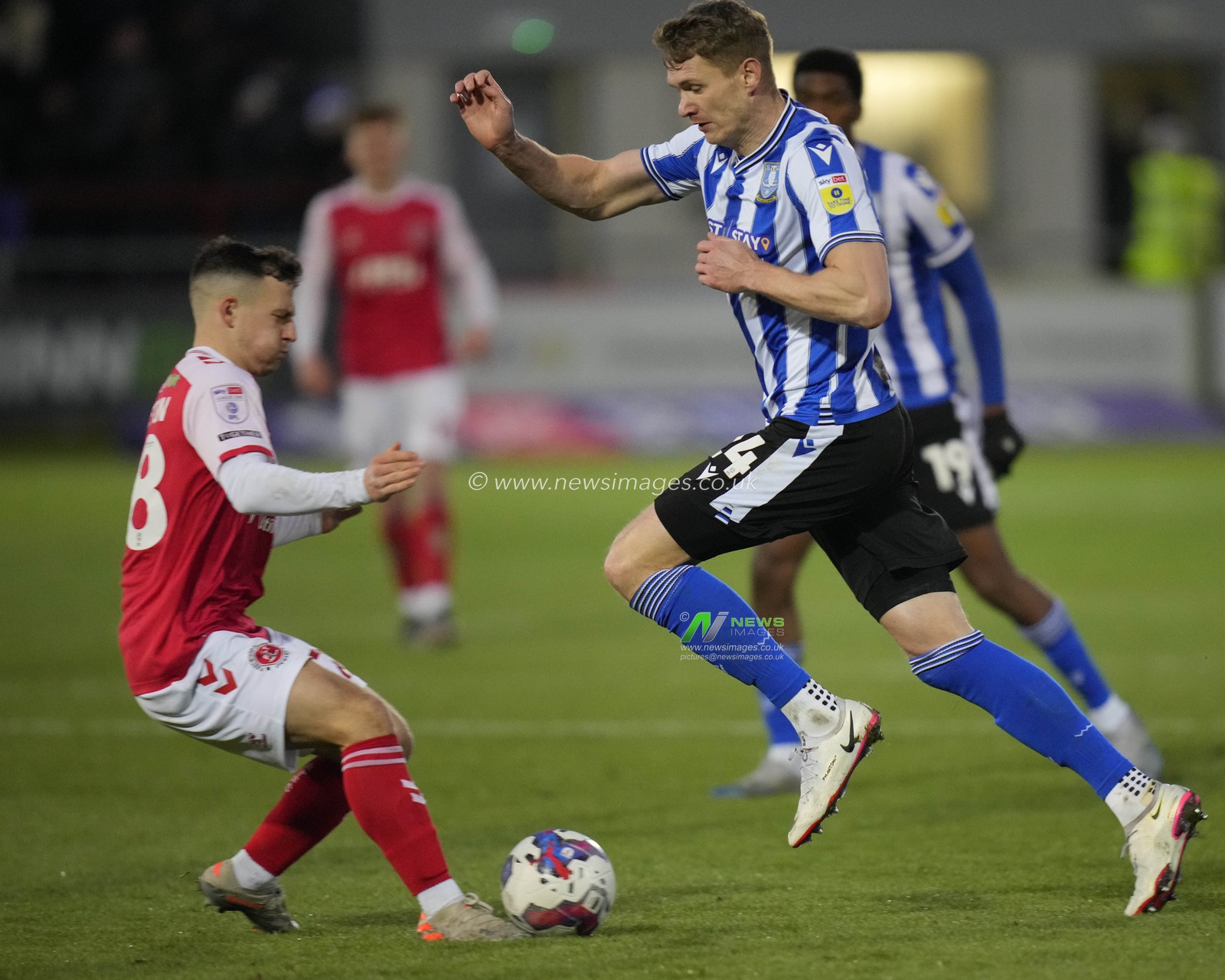 Michael Smith #24 of Sheffield Wednesday runs at Carl Johnston #28 of Fleetwood Town during the Sky Bet League 1 match Fleetwood Town vs Sheffield Wednesday at Highbury Stadium, Fleetwood, United Kingdom, 26th December 2022

(Photo by Steve Flynn/News Images)