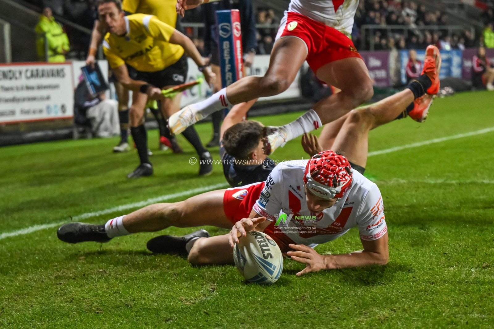 Harry Robertson of St. Helens goes over for a try during the Betfred Super League Round 1 match St Helens vs Salford Red Devils at Totally Wicked Stadium, St Helens, United Kingdom, 15th February 2025

(Photo by Craig Thomas/News Images)
