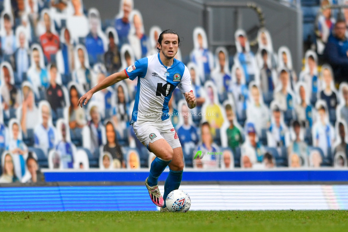 Lewis Travis (27) of Blackburn Rovers runs forward with the ball