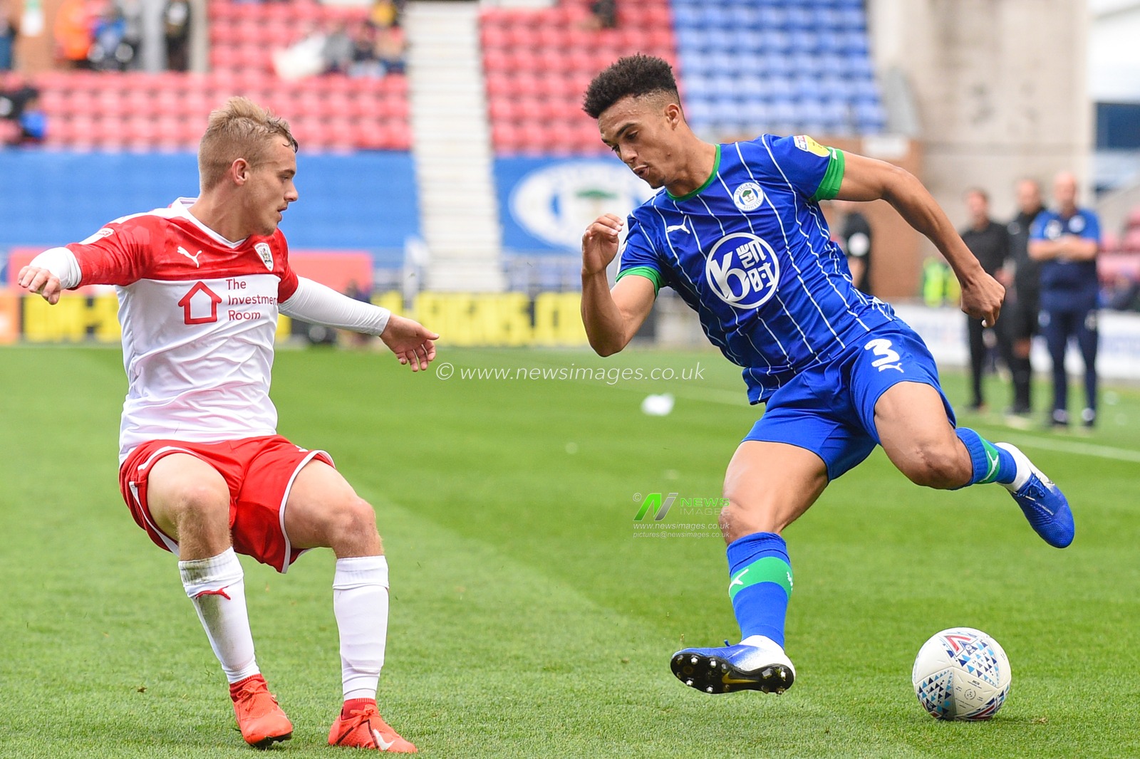 31st August  2019, DW Stadium, Wigan, England; Sky Bet Championship Football, Wigan Athletic vs Barnsley ; Antonee Robinson (3) of Wigan Athletic watched by Luke Thomas (16) of Barnsley 


Credit:Richard Long/News Images

English Football League images are subject to DataCo Licence