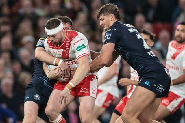 James Batchelor of Hull KR is tackled by Harry Smith of Wigan Warriors during the 2025 Betfred Super League Grand Final Hull KR v Wigan Warriors at Old Trafford, Manchester, United Kingdom, 11th October 2025

(Photo by Mark Cosgrove/News Images)