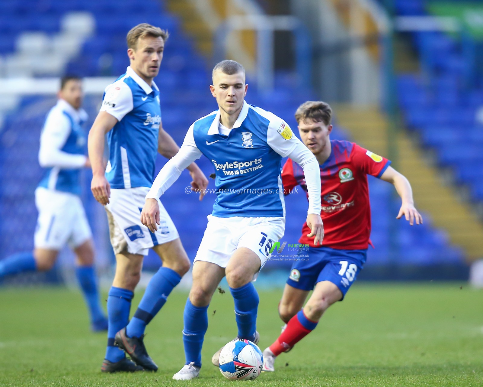 Riley McGree #18 of Birmingham City dribbles the ball