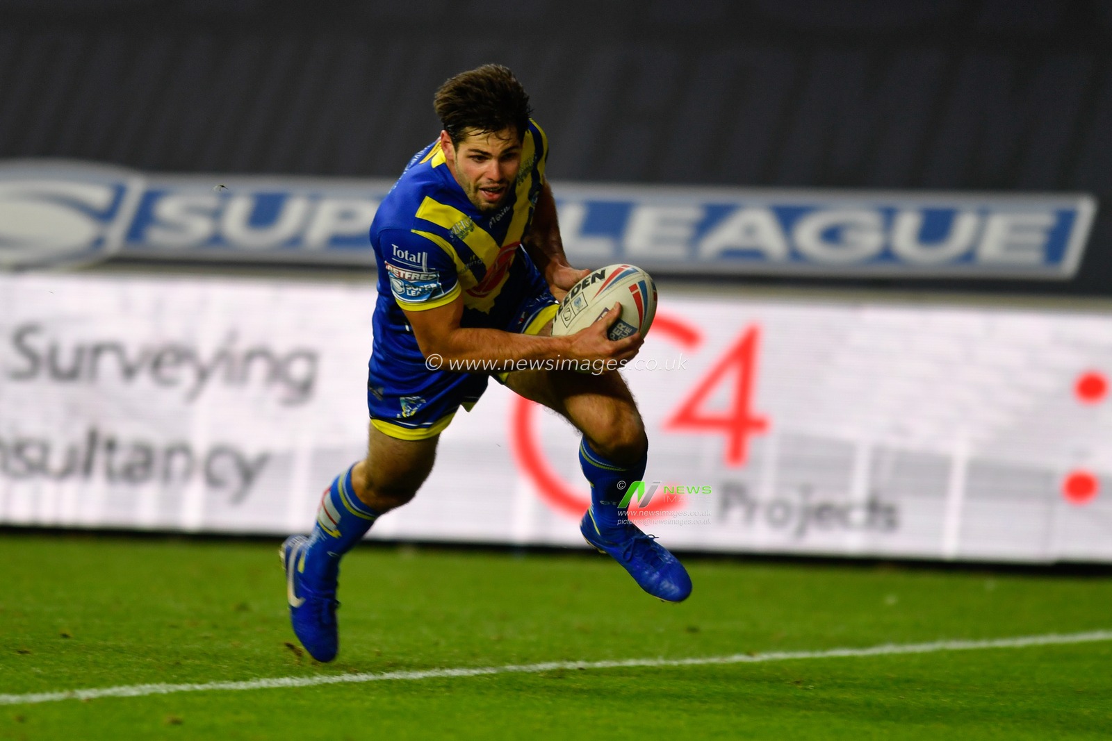 Jake Mamo (17) of Warrington Wolves goes over for a try