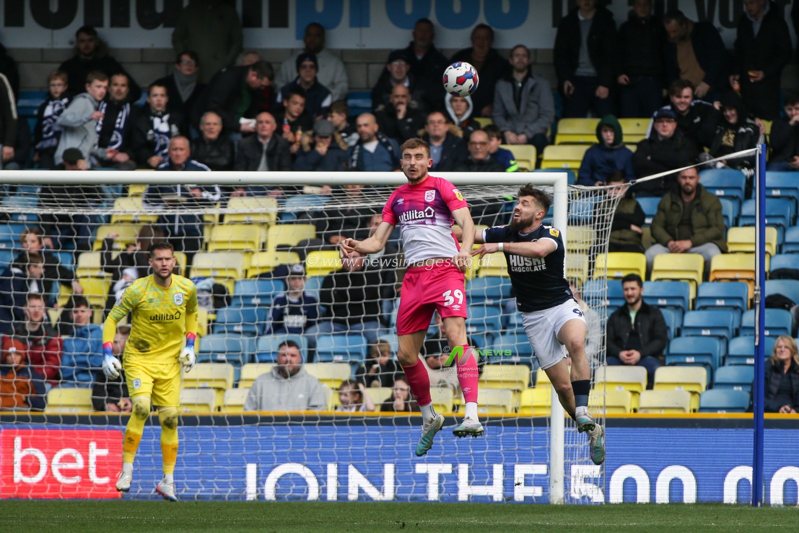 MichaÅ‚ Helik #39 of Huddersfield Town heads clear under pressure during the Sky Bet Championship match Millwall vs Huddersfield Town at The Den, London, United Kingdom, 18th March 2023

(Photo by Arron Gent/News Images)