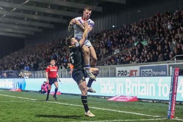 Tom Johnstone of Wakefield Trinity jumps up for the high ball to go over for a try however it is ruled out after a video review during the Betfred Super League Round 5 match Wakefield Trinity vs Hull FC at DIY Kitchens Stadium, Wakefield, United Kingdom, 21st March 2025

(Photo by Alfie Cosgrove/News Images)