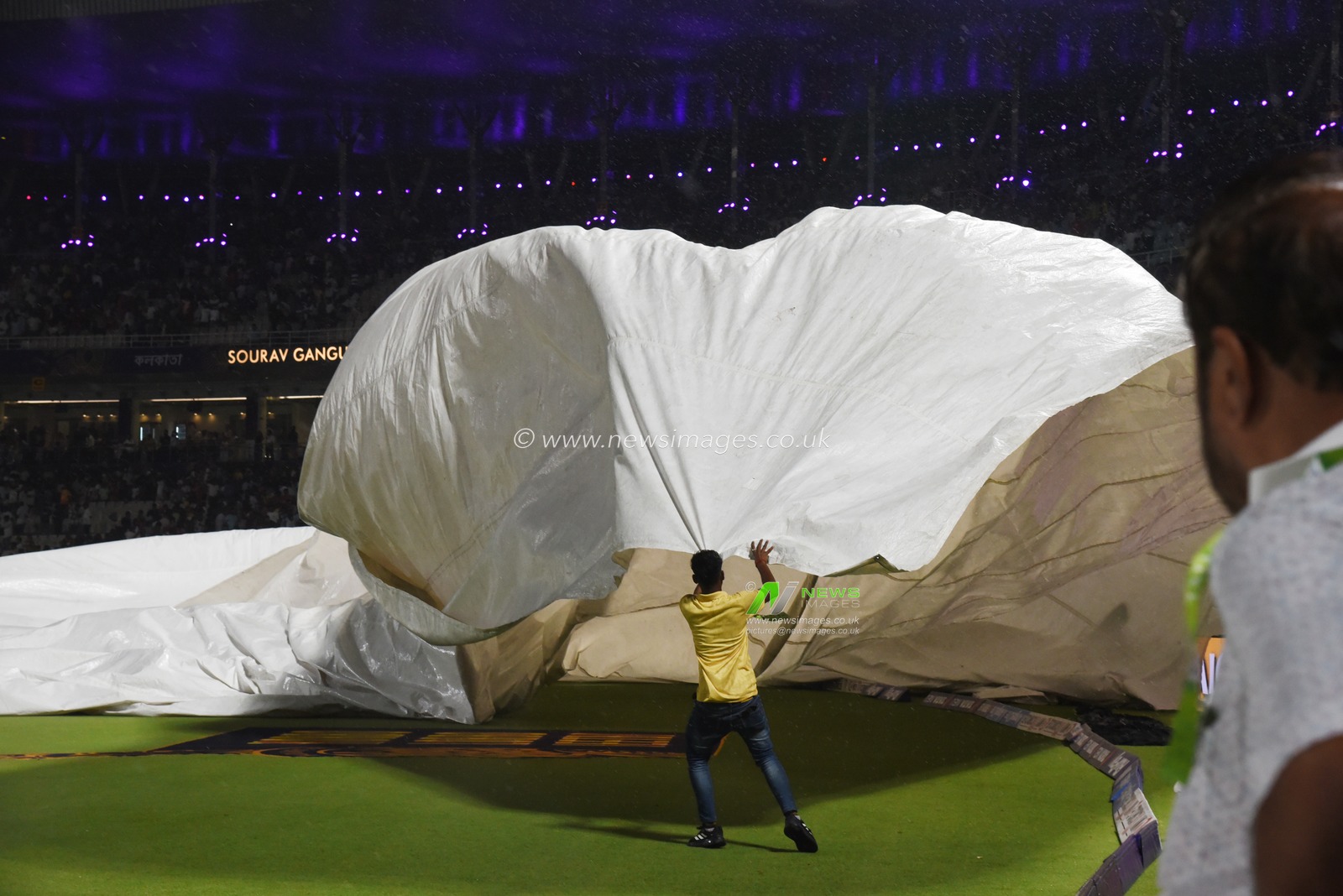 The ground staff work to keep the pitch dry as play is tries to stop the ball due to rain during the 2025 IPL match between Kolkata Knight Riders and Punjab Kings at Eden Gardens on April 26, 2025, in Kolkata, India. Photo by Debajyoti Chakraborty.(Photo: Debajyoti Chakraborty/News Images)