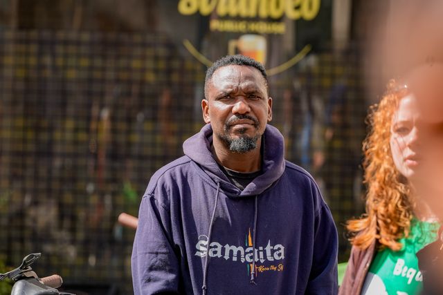 Blessed Mhlanga, a journalist imprisoned for 73 days and a guest at UN Watch recently looks on as Zimbabweans protest against the proposed constitution amendment at Embassy of Zimbabwe, London, United Kingdom on 18 April 2026

(Photo by Maynard Manyowa/News Images)