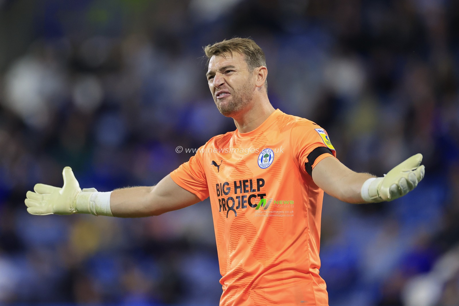 Jamie Jones #1 of Wigan Athletic shows his frustration to the referees assistant during the Sky Bet Championship match Huddersfield Town vs Wigan Athletic at John Smith's Stadium, Huddersfield, United Kingdom, 13th September 2022

(Photo by Conor Molloy/News Images)