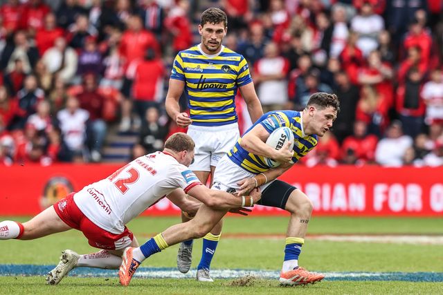 Josh Thewlis of Warrington Wolves is tackled by James Batchelor of Hull KR during the Betfred Challenge Cup Semi-Finals match Warrington Wolves vs Hull KR at Eco-Power Stadium, Doncaster, United Kingdom on 10 May 2026

(Photo by Alfie Cosgrove/News Images)