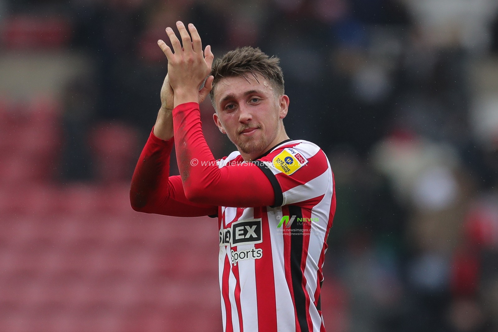 Dan Neil #24 of Sunderland claps his hands and applauds the supporters at full-time after the Sky Bet Championship match Sunderland vs Middlesbrough at Stadium Of Light, Sunderland, United Kingdom, 22nd January 2023

(Photo by James Heaton/News Images)