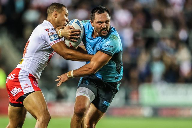 Jordan Rapana of Hull FC is tackled by Moses Mbye of St. Helens during the Betfred Super League round 23 match St Helens vs Hull FC at Totally Wicked Stadium, St Helens, United Kingdom, 22nd August 2025

(Photo by Alfie Cosgrove/News Images)