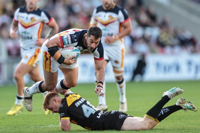 Benjamin Garcia of Catalans Dragons is tackled by Tom Inman of York Knights during the Betfred Super League round 12 match York Knights vs Catalans Dragons at LNER Community Stadium, York, United Kingdom on 23 May 2026

(Photo by Mark Cosgrove/News Images)