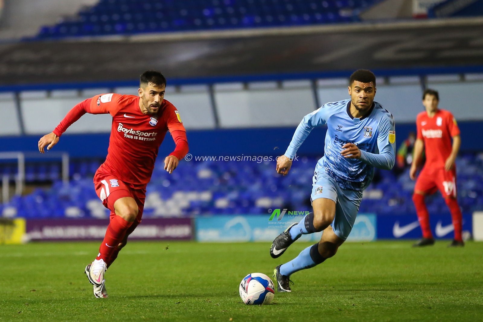 Maxime Colin #2 of Birmingham City dribbles the ball whilst being chased by Maxime Biamou #9 of Coventry City