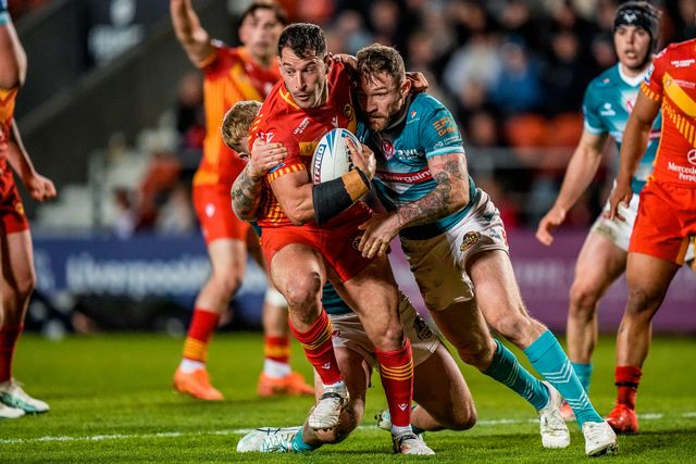 Benjamin Garcia of Catalans Dragons is tackled by George Delaney of St Helens during the Betfred Challenge Cup Quarter Final match St Helens vs Catalans Dragons at The BrewDog Stadium, St Helens, United Kingdom on 10 April 2026

(Photo by Maynard Manyowa/News Images)
