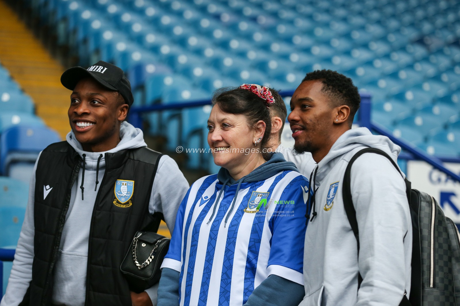 A fan has a photo with Sheffield Wednesday players during the Sky Bet League 1 match Sheffield Wednesday vs Plymouth Argyle at Hillsborough, Sheffield, United Kingdom, 4th February 2023

(Photo by Arron Gent/News Images)
