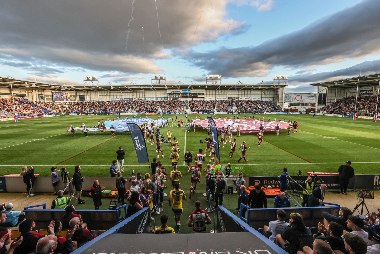 The teams come out for the game during the Betfred Super League round 21 match Warrington Wolves vs Wigan Warriors at Halliwell Jones Stadium, Warrington, United Kingdom, 8th August 2025

(Photo by Alfie Cosgrove/News Images)