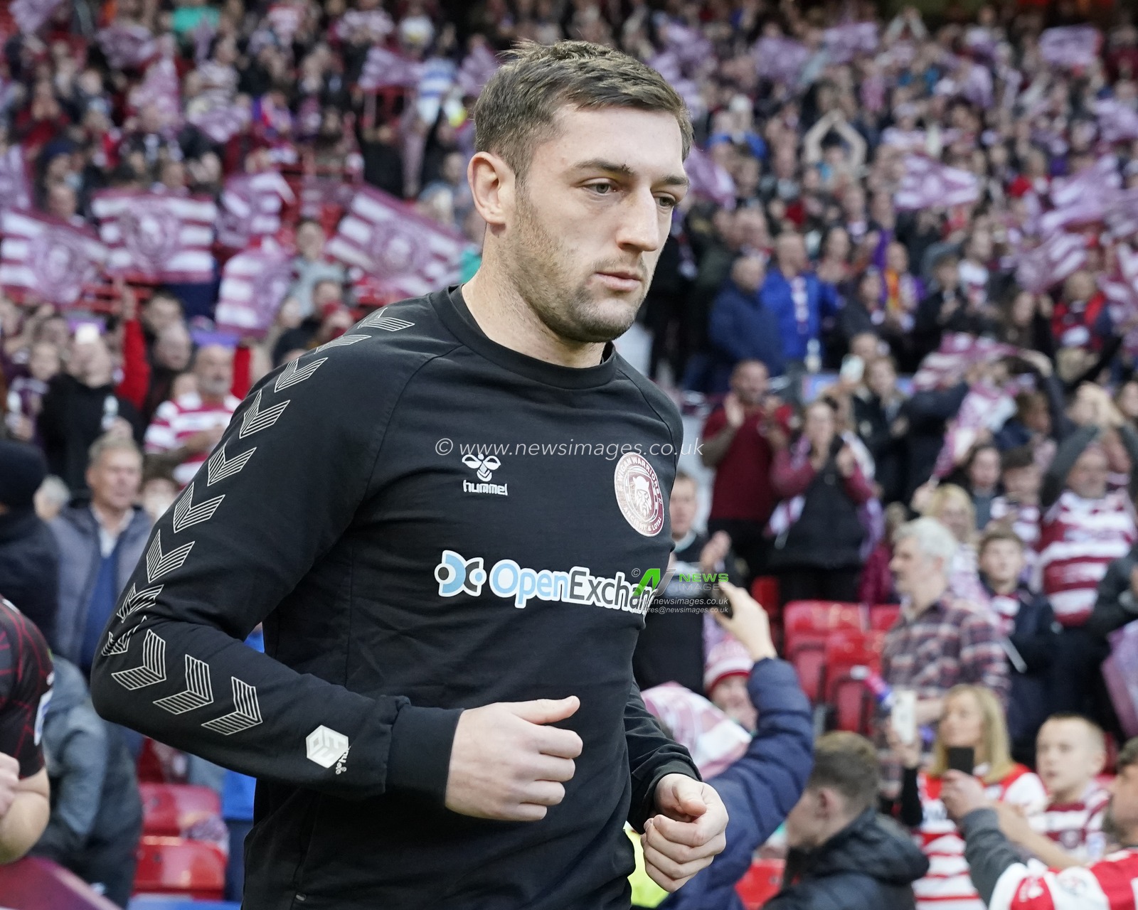 Jake Wardle #4 of Wigan Warriors runs out for the warm up before the Betfred Super League Grand Final match Wigan Warriors vs Catalans Dragons at Old Trafford, Manchester, United Kingdom, 14th October 2023

(Photo by Steve Flynn/News Images)