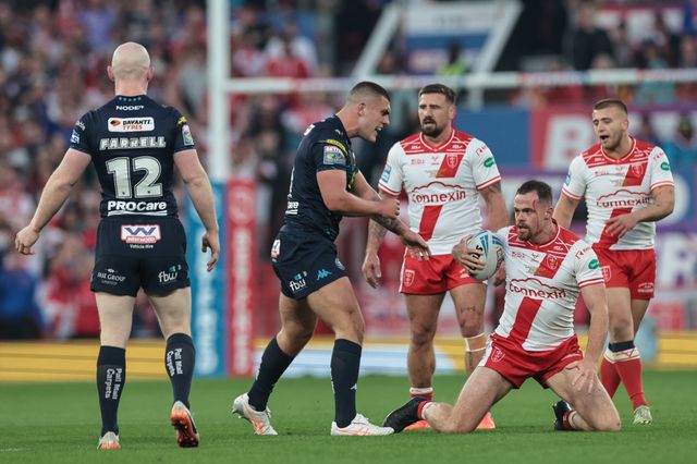 Joe Burgess of Hull KR is confronted by Brad O'neill of Wigan Warriors after a heated tackle during the 2025 Betfred Super League Grand Final Hull KR v Wigan Warriors at Old Trafford, Manchester, United Kingdom, 11th October 2025

(Photo by Mark Cosgrove/News Images)