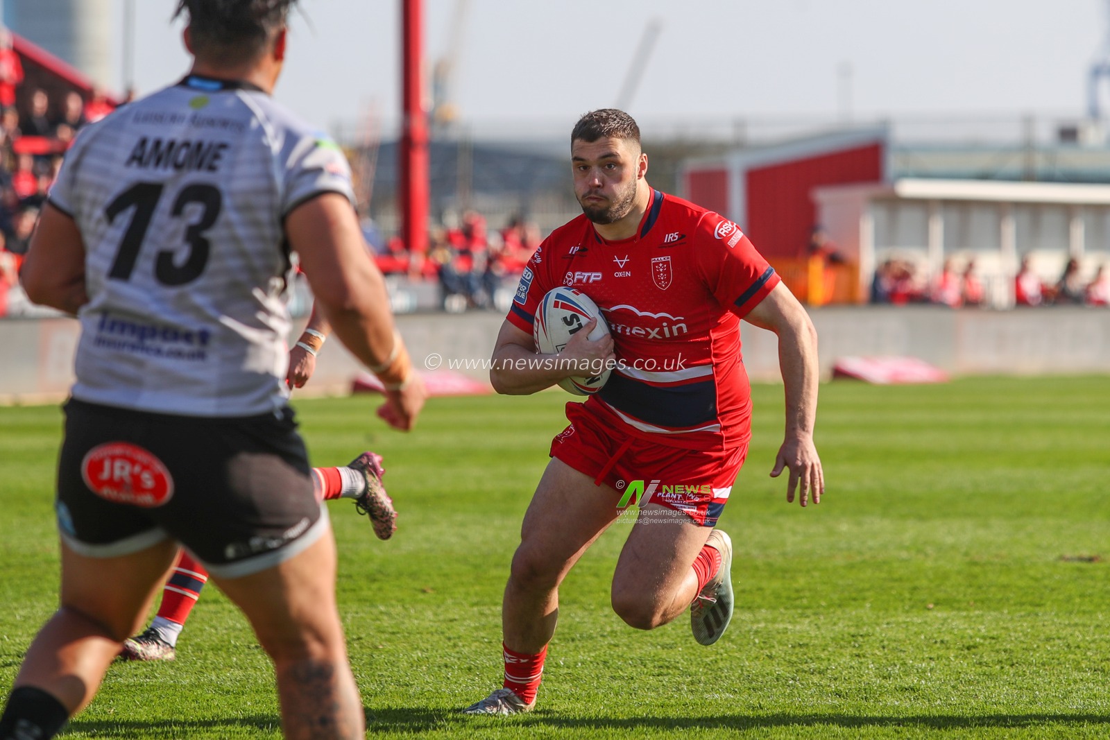 Matty Storton #13 of Hull KR runs at Tom Amone #13 of Leigh Centurions