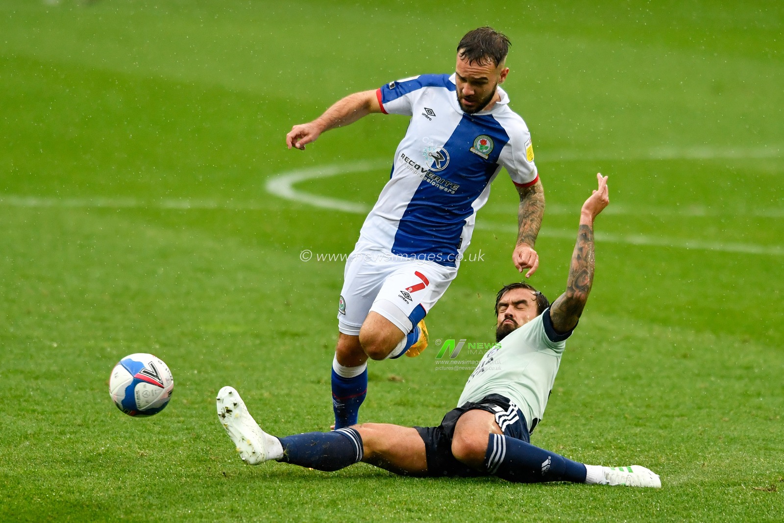 Marlon Pack (21) of Cardiff City takes the ball from Adam Armstrong (7) of Blackburn Rovers with a sliding tackle