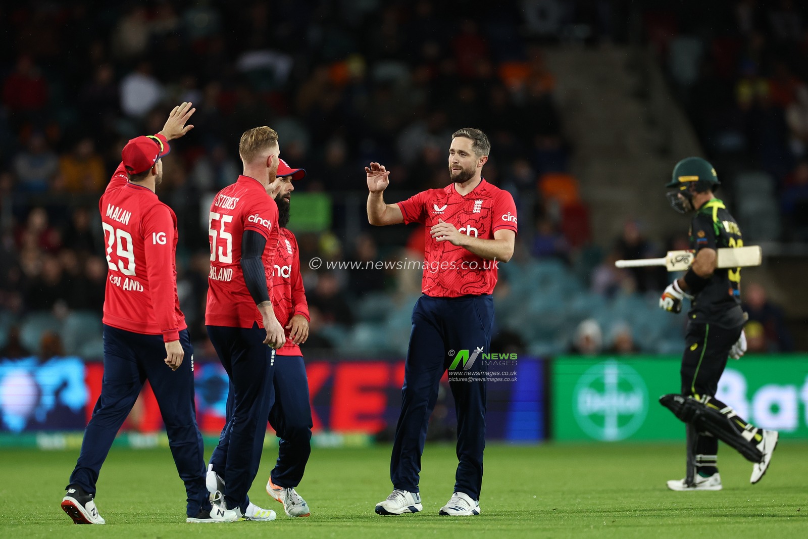 Moeen Ali of England and Chris Woakes of England celebrate the dismissal of Glenn Maxwell of Australia  during the Dettol T20I Series 3 of 3 Australia vs England at Manuka Oval, Canberra, Australia, 14th October 2022

(Photo by Patrick Hoelscher/News Images)